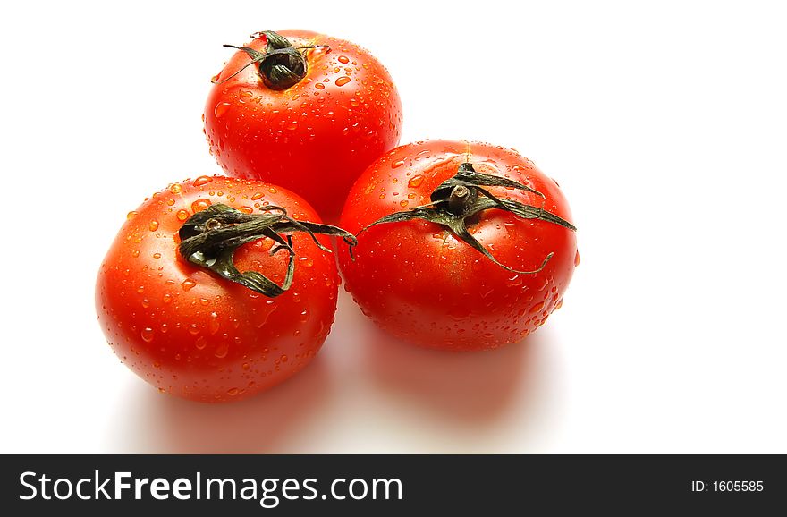 Fresh wet tomatoes isolated on white background. Fresh wet tomatoes isolated on white background