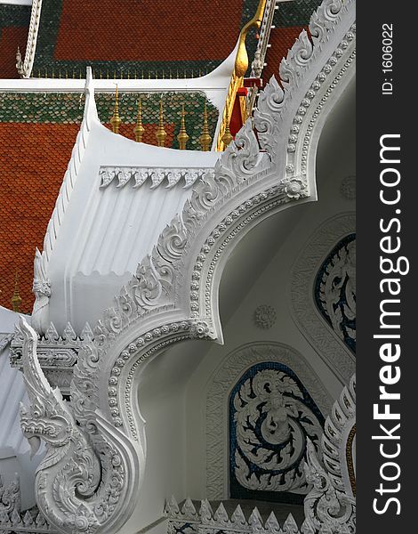 Roofs of a temple complex in Bangkok, Thailand showing architectural details. Roofs of a temple complex in Bangkok, Thailand showing architectural details