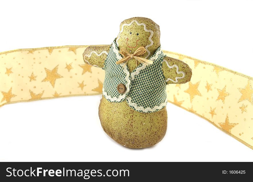 Gingerbread man against gold ribbon with stars - isolated. Gingerbread man against gold ribbon with stars - isolated