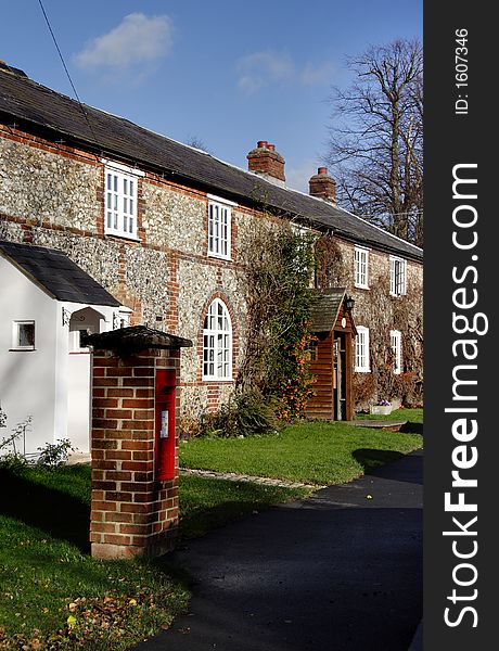Quaint Row of Brick and Flint Cottages in a Rural Village Street in England. Quaint Row of Brick and Flint Cottages in a Rural Village Street in England