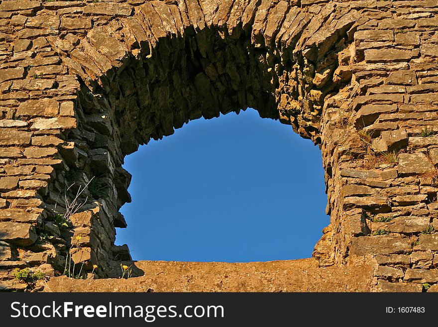 Arched window from Pennnard Castle in the Gower peninsula, South wales UK. Arched window from Pennnard Castle in the Gower peninsula, South wales UK