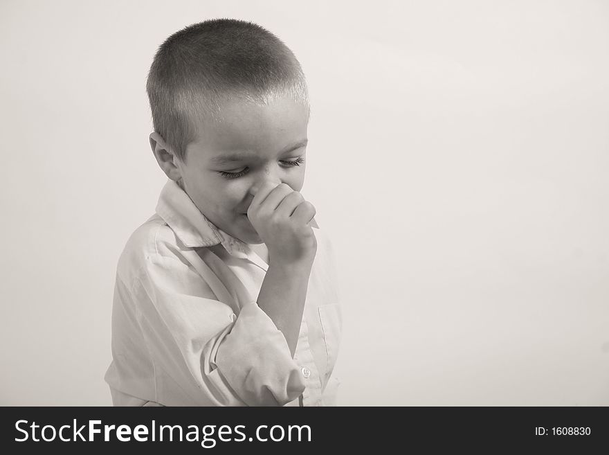 A small boy is sucking his thumb because his is upset