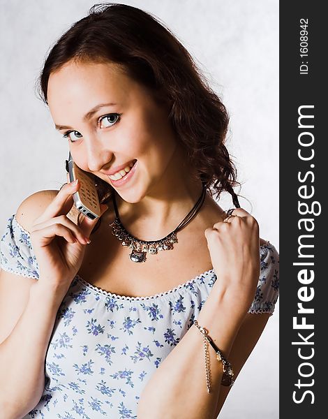 Attractive young woman calling by phone