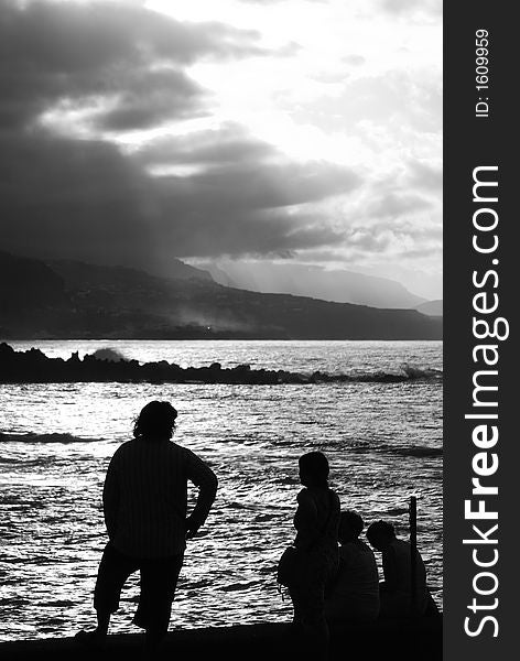 Silhouettes in the afternoon, group of tourists in back-lighting condition, late afternoon, b&w image