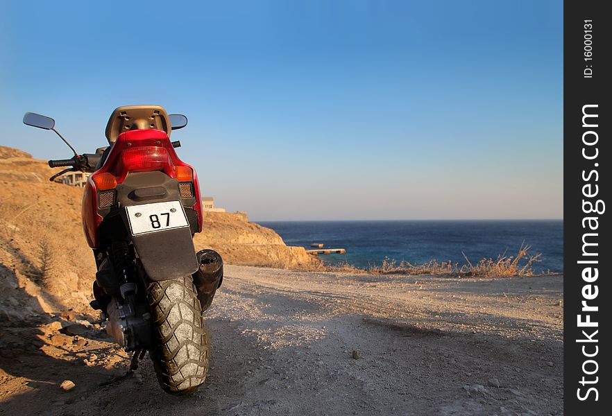 Motorbike standing on a beach. Motorbike standing on a beach