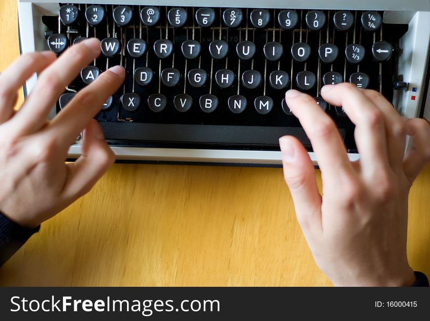 Fingers poised, read to type on a typewriter. Fingers poised, read to type on a typewriter.