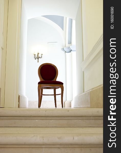 Empty corridor with sunlight and empty red armchair. Empty corridor with sunlight and empty red armchair