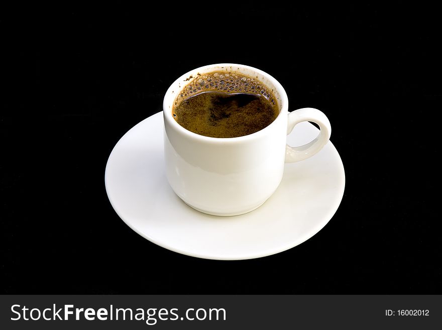 White cup of coffee on black background