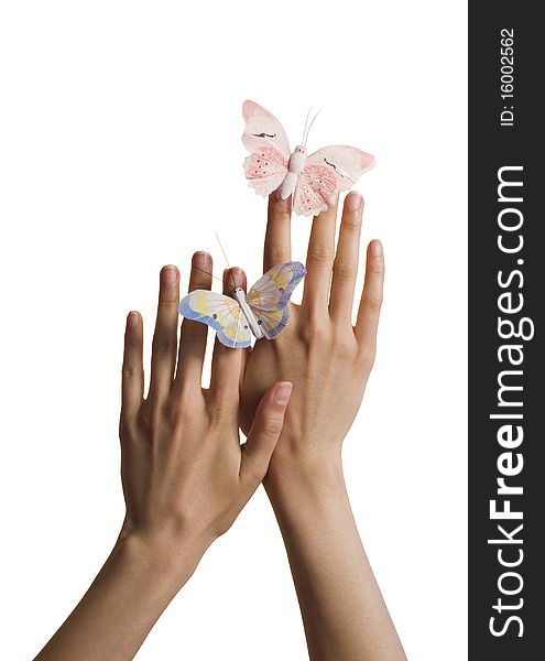 Two butterflies (pink and blue) on hands isolated on white. Two butterflies (pink and blue) on hands isolated on white