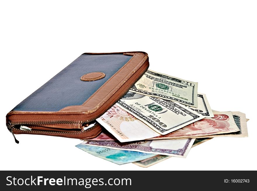 An old large wallet with money from different countries. An old large wallet with money from different countries.
