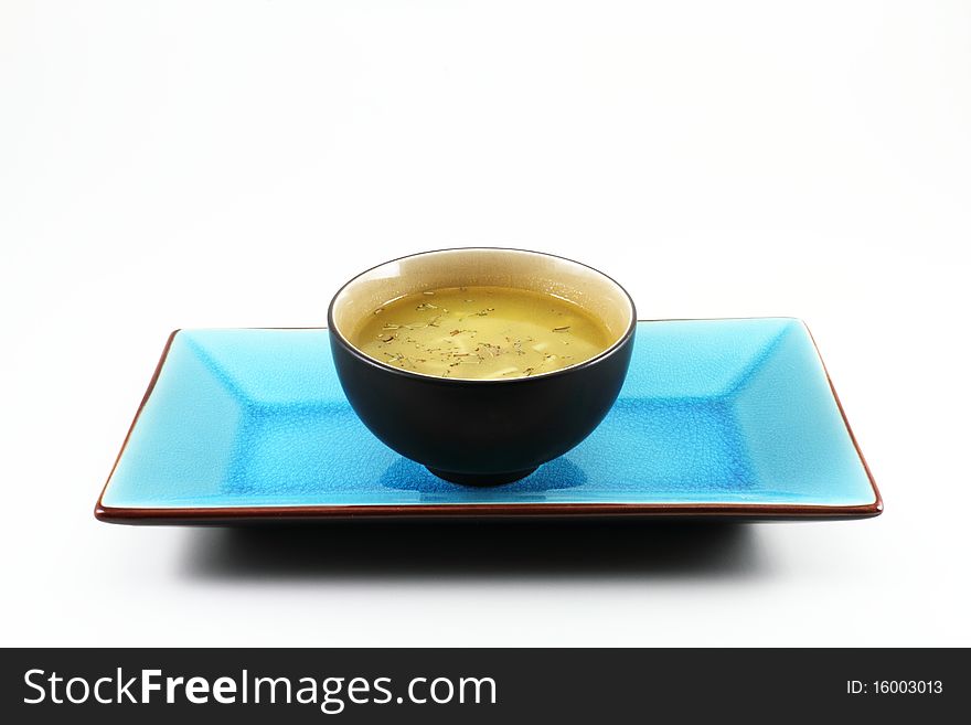 Traditional oriental Tabe Setting with a blue tray and a bowl of soup. Traditional oriental Tabe Setting with a blue tray and a bowl of soup.
