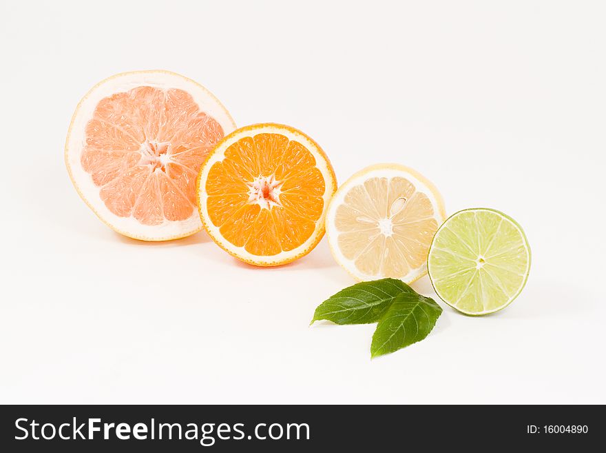 Fresh half of grapefruit, lemon, orange and lime.