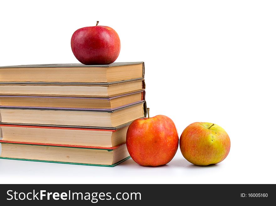 Apples and books isolated on a white background