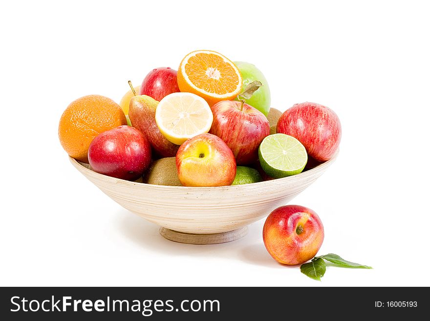 Full bamboo plate of fresh fruits isolated on white