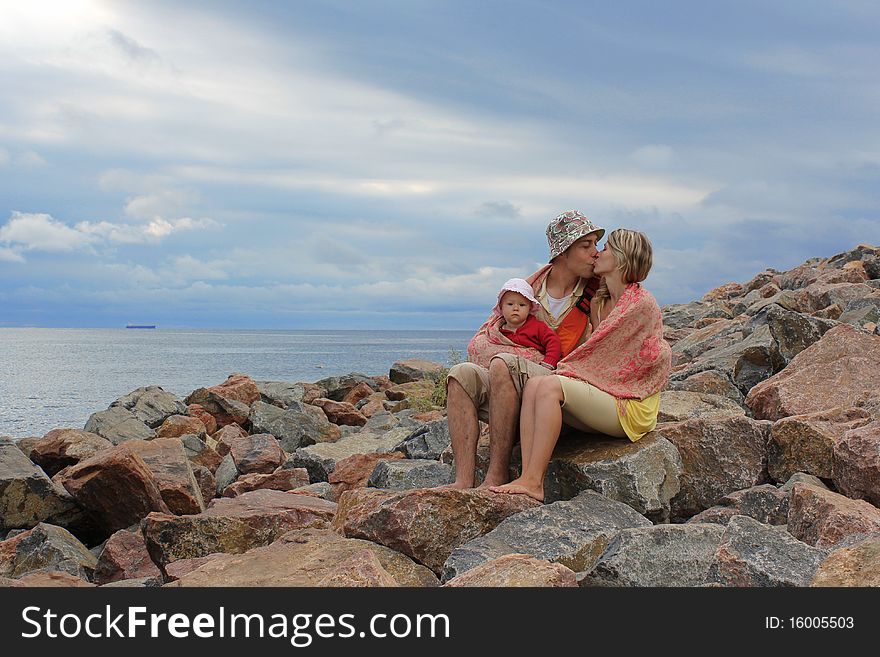 Family sitting on the rocks