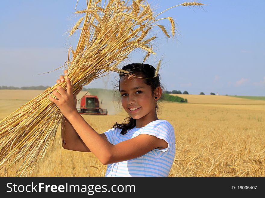 Young Gypsy smiling girl on a grain field. Young Gypsy smiling girl on a grain field