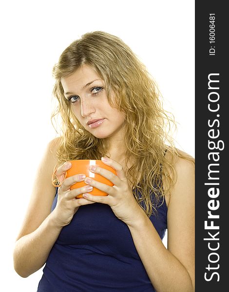 Pretty young woman with an orange cup of tea / coffee. Isolated on white background. Pretty young woman with an orange cup of tea / coffee. Isolated on white background