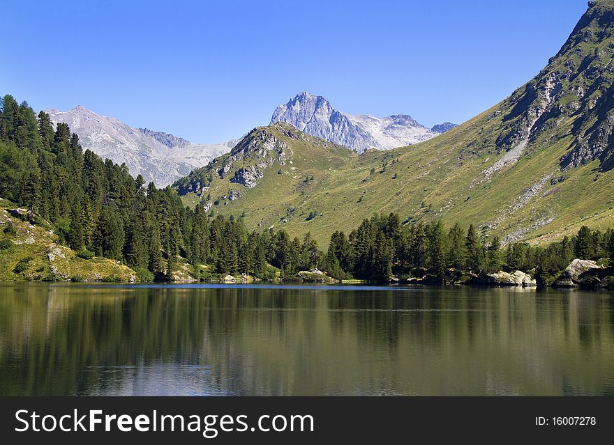 Alpine lake Cavloc Engadine in Switzerland