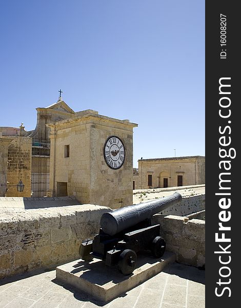 Malta, gozo island, cannon and clock