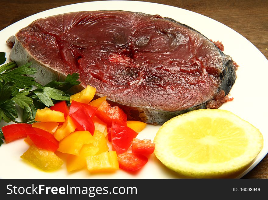 A dish with fresh tuna and vegetables. A dish with fresh tuna and vegetables