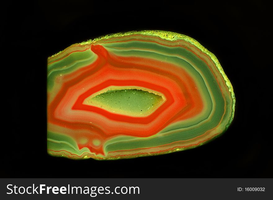 Colorful enigmatic geode stone from Germany at black background
