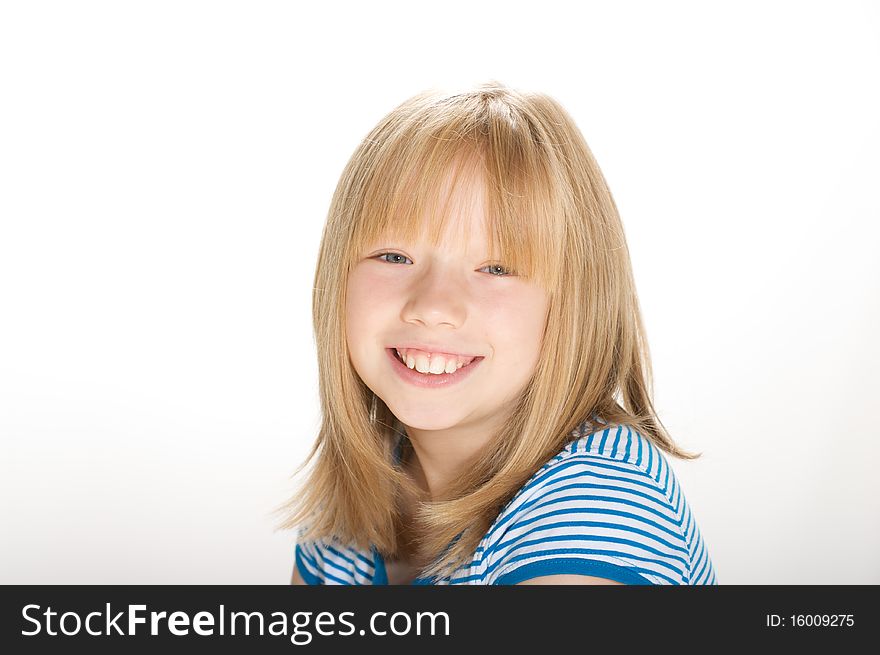 Young girl smiling and looking into the camera. Young girl smiling and looking into the camera