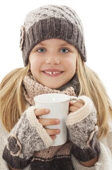 Smiling Little Girl With A White Cup Of Hot Drink. Winter Style Stock Photos