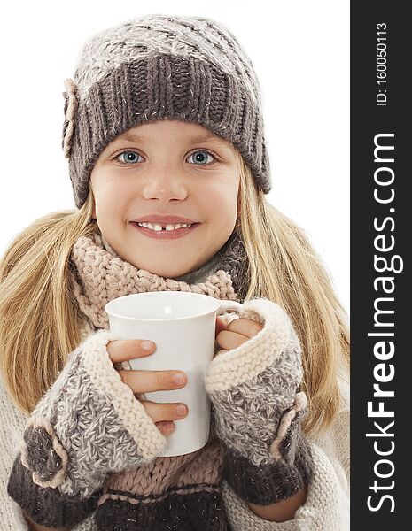 Smiling little girl with a white cup of hot drink. Winter style, Isolated on white background