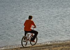 Boy Riding A Bicycle On A Beach Royalty Free Stock Images Boy Riding A Bicycle On A Beach Royalty Free Stock Images