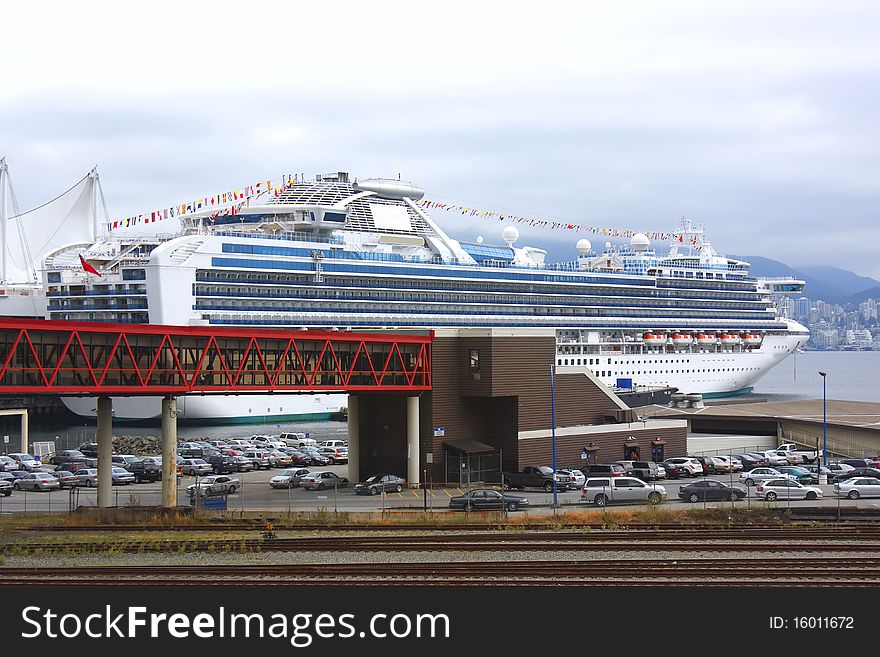 A cruise ship is docked at the Canada place in Vancouver BC. A cruise ship is docked at the Canada place in Vancouver BC.