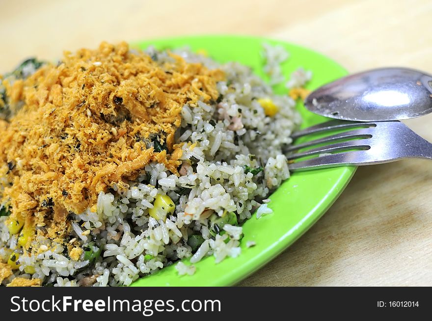 Asian vegetable olive fried rice with pork floss topping. Suitable for concepts such as diet and nutrition, healthy lifestyle, and food and beverage. Asian vegetable olive fried rice with pork floss topping. Suitable for concepts such as diet and nutrition, healthy lifestyle, and food and beverage.