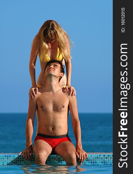 Woman And Man Beside Water Pool