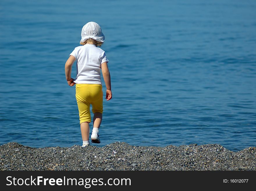 Child Walking On Seaside