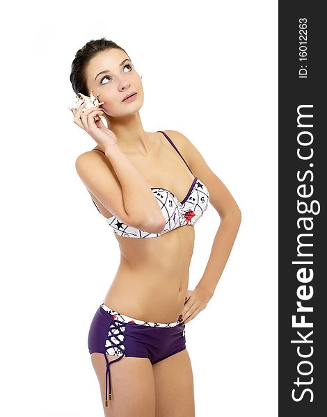 Young fashion model posing in swimsuit isolated