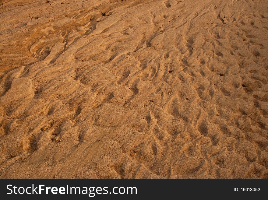 The brown sand is lined with beautiful waves taken from the beach beside the river in Thailand. The brown sand is lined with beautiful waves taken from the beach beside the river in Thailand