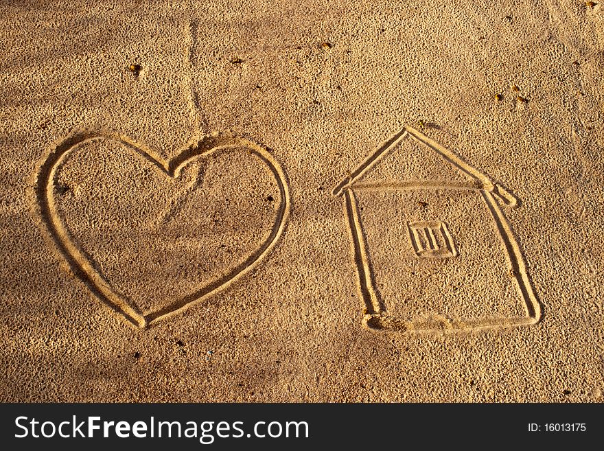 Brown sand with drawing hearts and homes taken from the beautiful beaches, rivers in Thailand. Brown sand with drawing hearts and homes taken from the beautiful beaches, rivers in Thailand