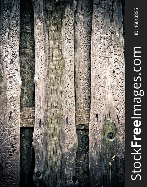 Old wooden fence with rusty nails background