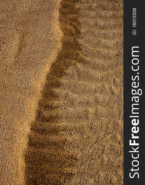 Smooth brown sand and the waves mixed with chestnut alternately taken from the beautiful beaches, rivers in Thailand. Smooth brown sand and the waves mixed with chestnut alternately taken from the beautiful beaches, rivers in Thailand