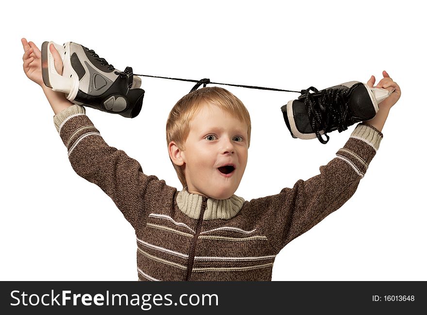 The little boy with the skates in a knitted sweater has lifted the skates over a head. Isolated on white background. The little boy with the skates in a knitted sweater has lifted the skates over a head. Isolated on white background.