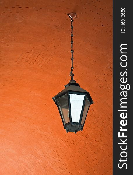 Lantern on a brick ceiling