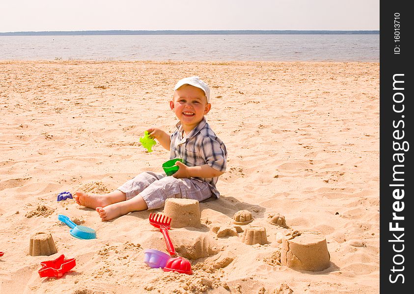 Little boy play on a beach. Little boy play on a beach