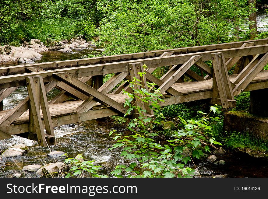 Wooden bridge over whitewater in the Black Forest
