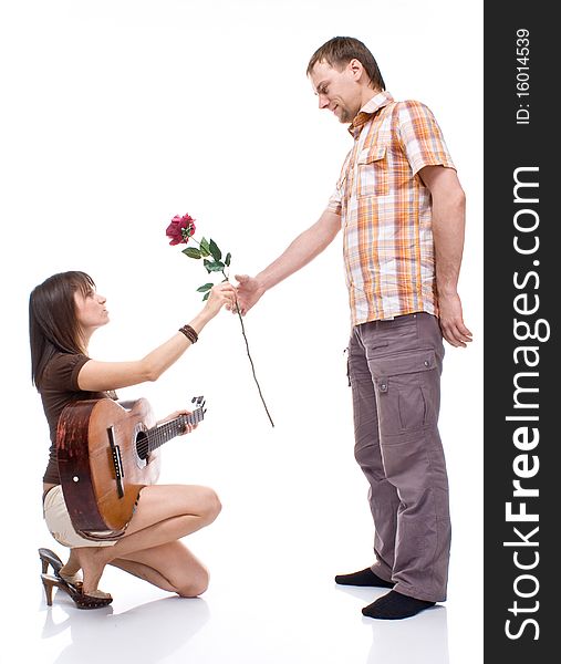 Girl gives the boy a rose on white background