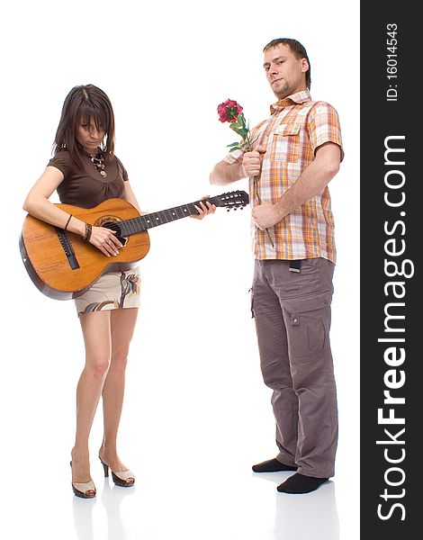 Girl with a guitar and a young man with a rose on white background