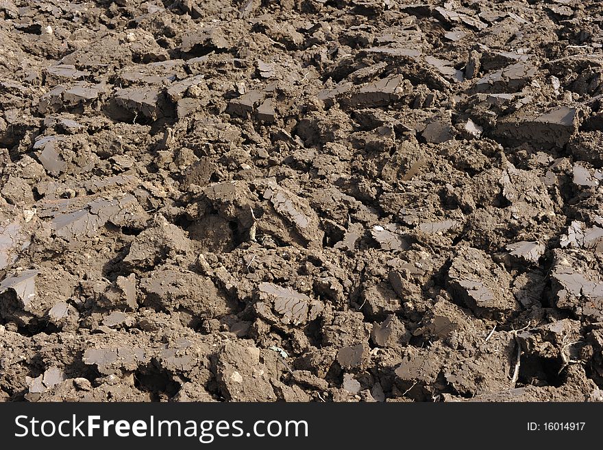 Clods of earth on a plowed field. Can be used as background.