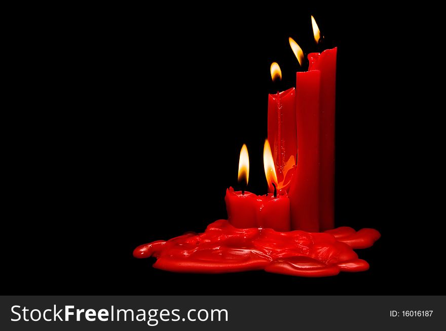 Red candles on a black background