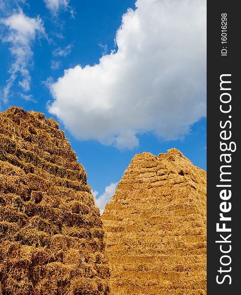 Haystack under beautiful blue sky