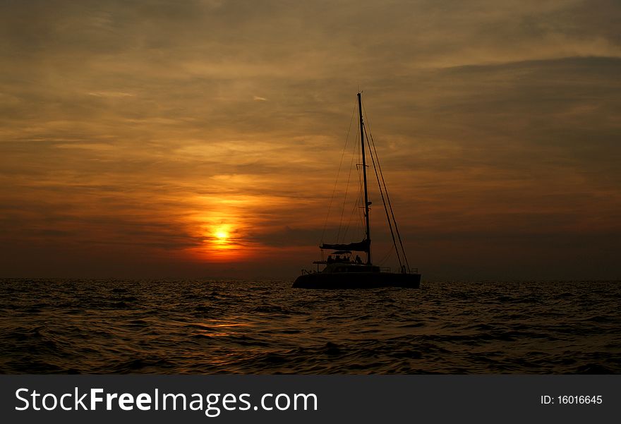 Landscape with the yacht against the coming sun