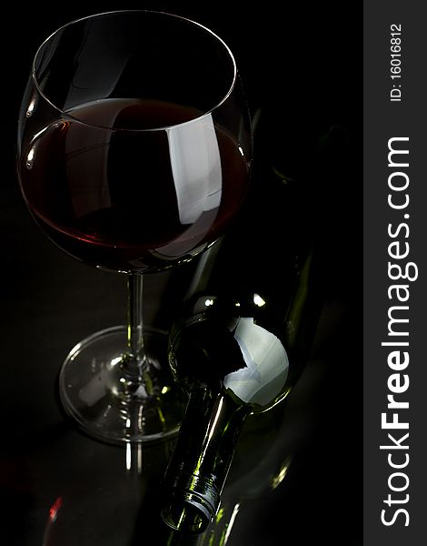 Glass of red wine on a dark background