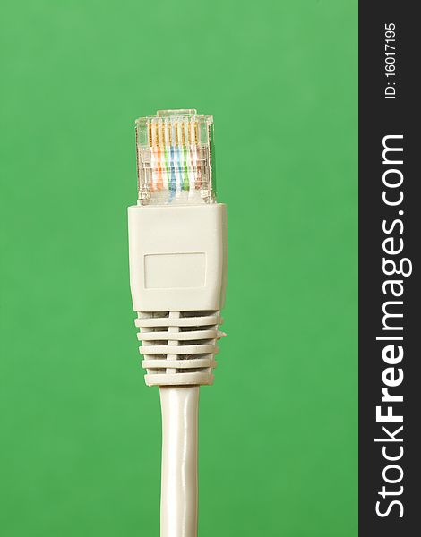 Close up of Ethernet Cable on a green background